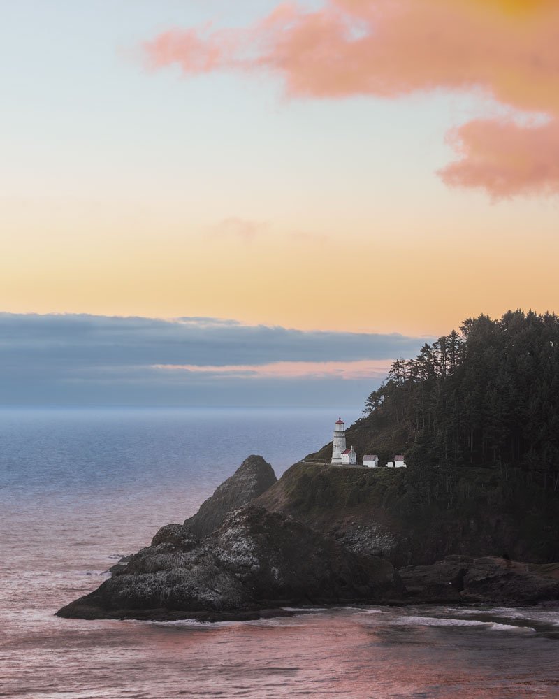 Heceta Head Lighthouse overlooking the Oregon Coast at sunset