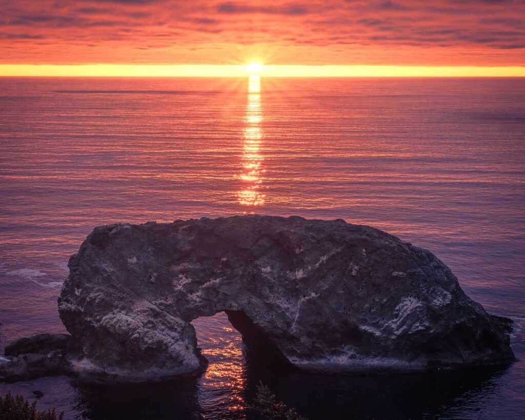 Arch Rock overlooking the Pacific Ocean at sunset along the Samuel H. Boardman Scenic Corridor on
the Oregon Coast.